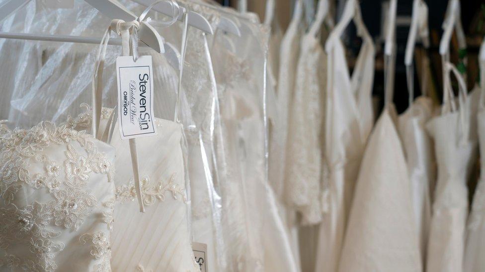 Designer labels in the donated wedding dresses.