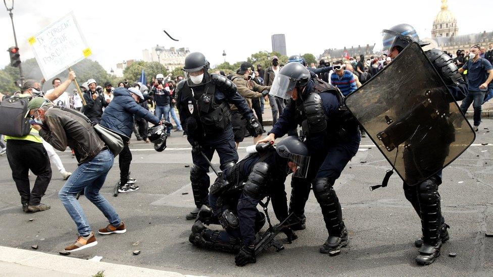 French riot police receive projectiles during an anti-government protest in Paris, France, 16 June 2020