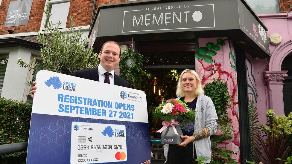 Economy Minister Gordon Lyons with Milana Surova of Memento florists on the Ormeau Road, Belfast