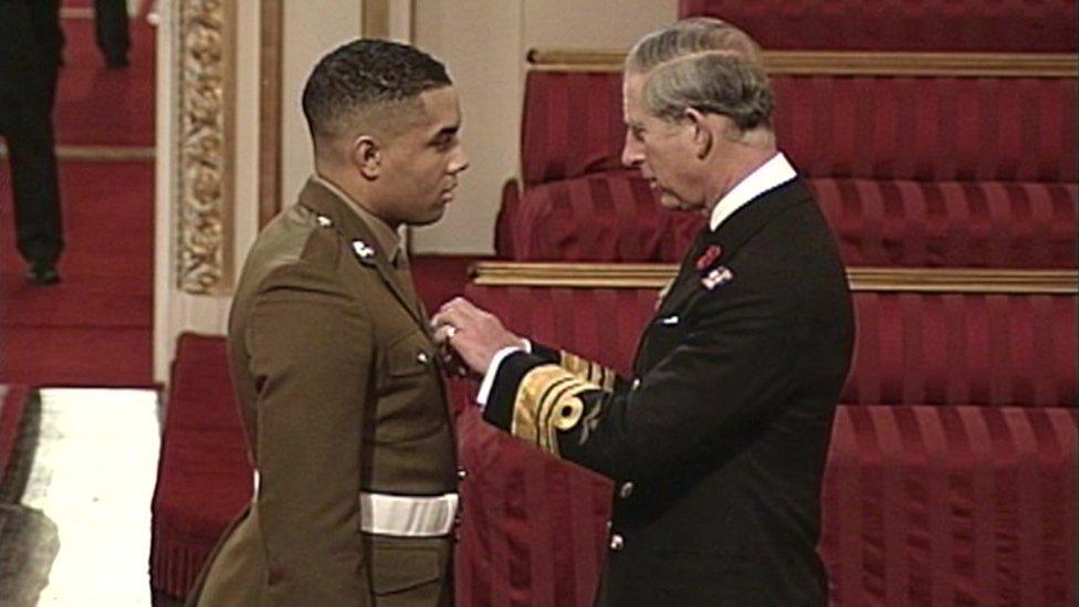 Daniel being awarded the George Medal by Prince Charles