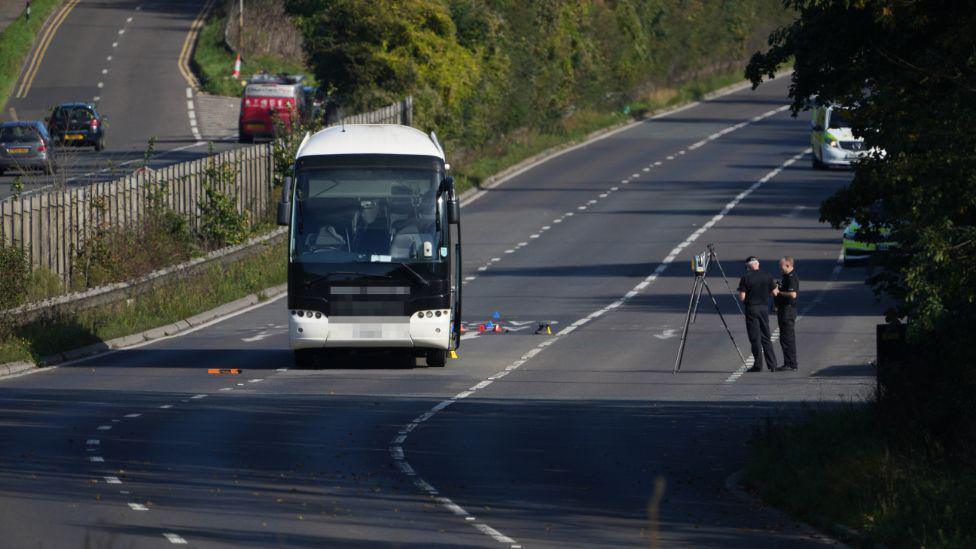 Police on the A27 alongside coach