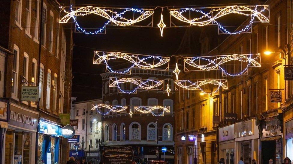 Christmas lights turned on in a city centre high street