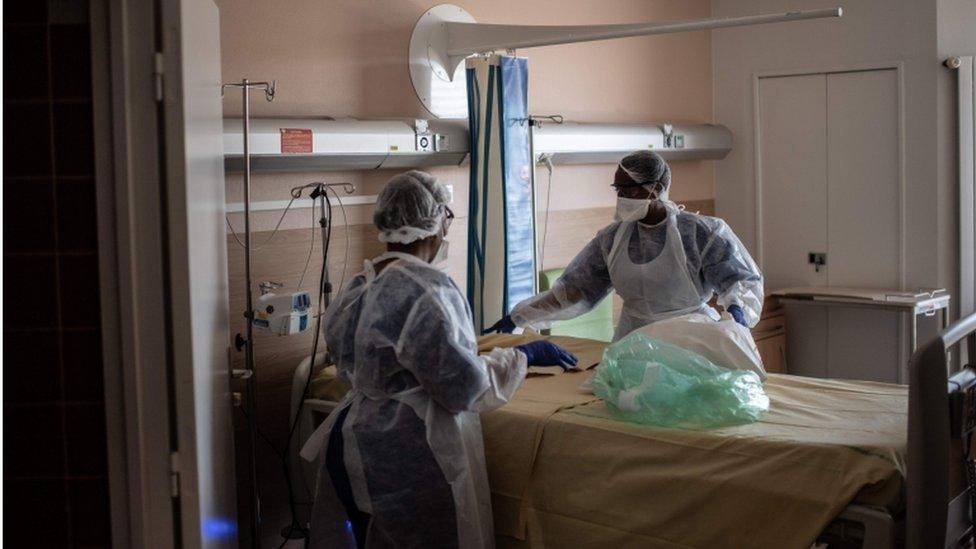 Nurses clean a room at Saint-Louis hospital in Paris, on May 28, 2020