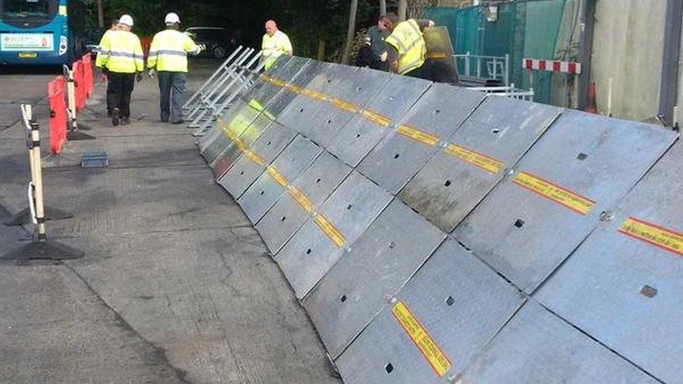 Temporary flood defence being put up in Guildford