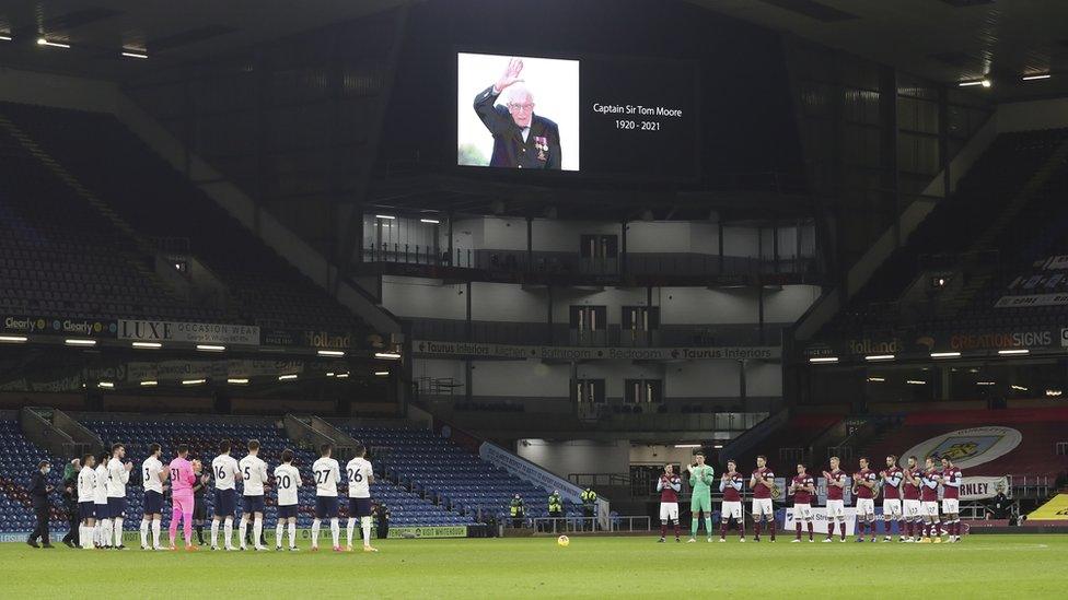 Players from Burnley FC and Manchester City clap