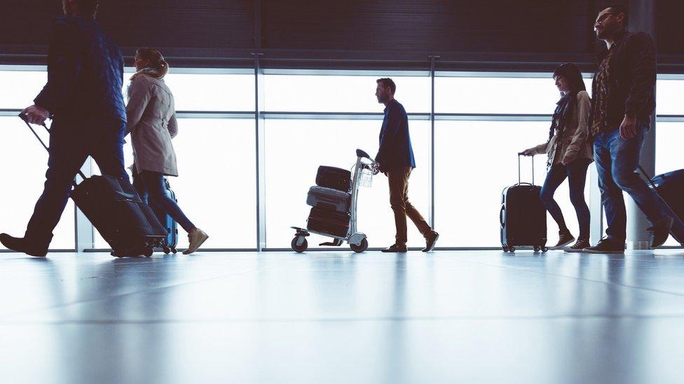 People walking through airport