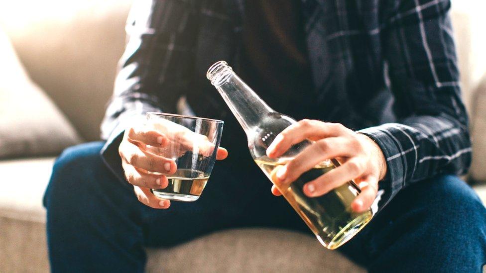 Man pouring beer at home