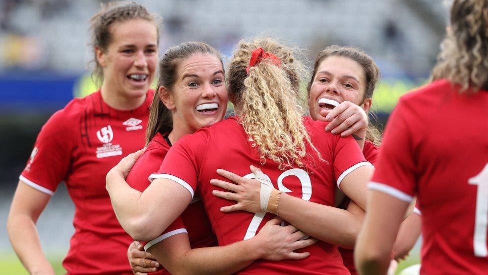 The England Women's Rugby team, celebrating