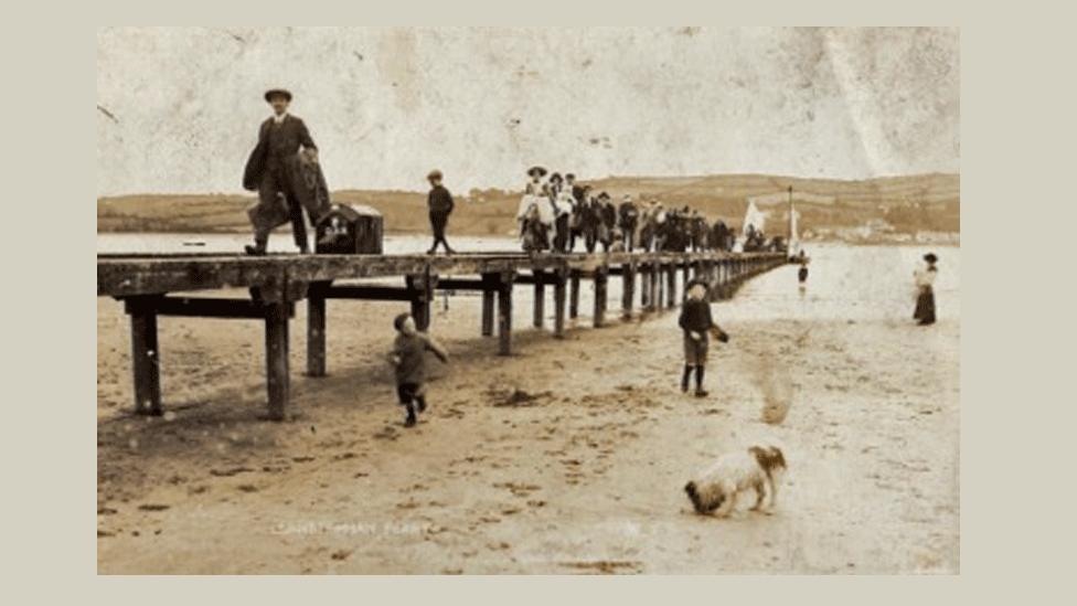 Old picture postcard shows Victorian travellers on the jetty