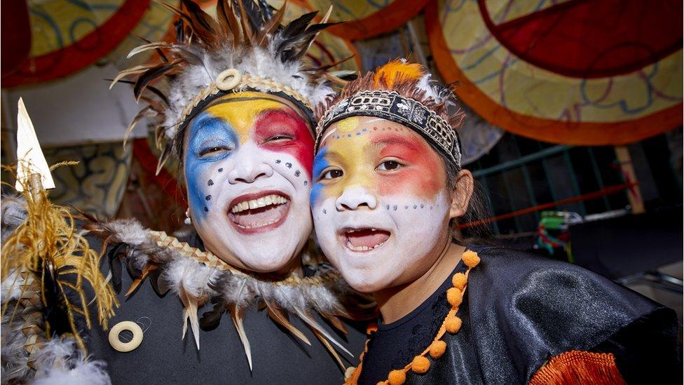 People in face paints enjoying Manchester Day 2019