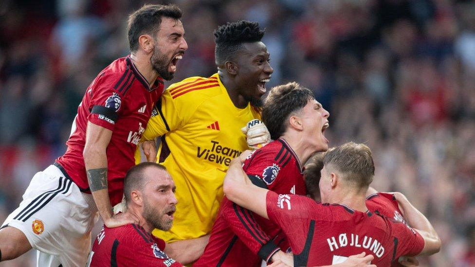 Scott McTominay of Manchester United celebrates scoring the winning goal with team mates at Old Trafford on October 7, 2023 in Manchester