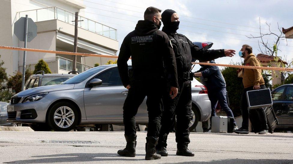 Police at the scene of the killing in Athens, 9 April