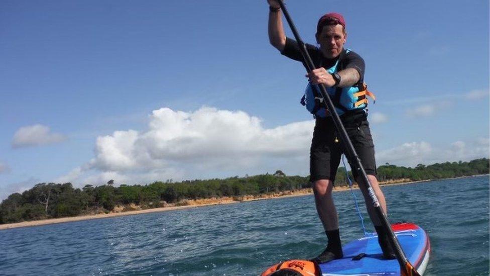 Joe Cartwright on a paddleboard