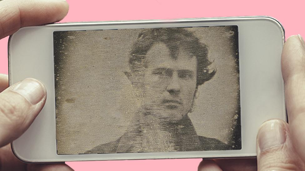 A phone showing Robert Cornelius's selfie