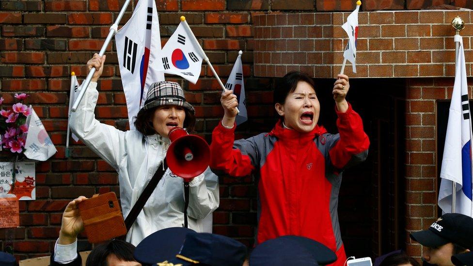 Supporters of impeached South Korean former President Park Geun-hye, gather around her home