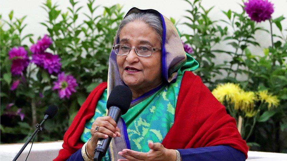 Bangladesh Prime Minister Sheikh Hasina speaks with foreign election observers and journalists at the Gono Bhaban in Dhaka