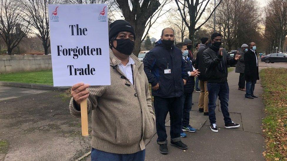 Drivers holding signs in the protest