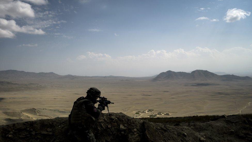 A French soldier secures a perimeter on September 26, 2012, on a forward observing post near the National Police Training Center (NPTC) in Wardak province