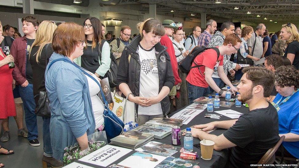 People queuing up for autographs