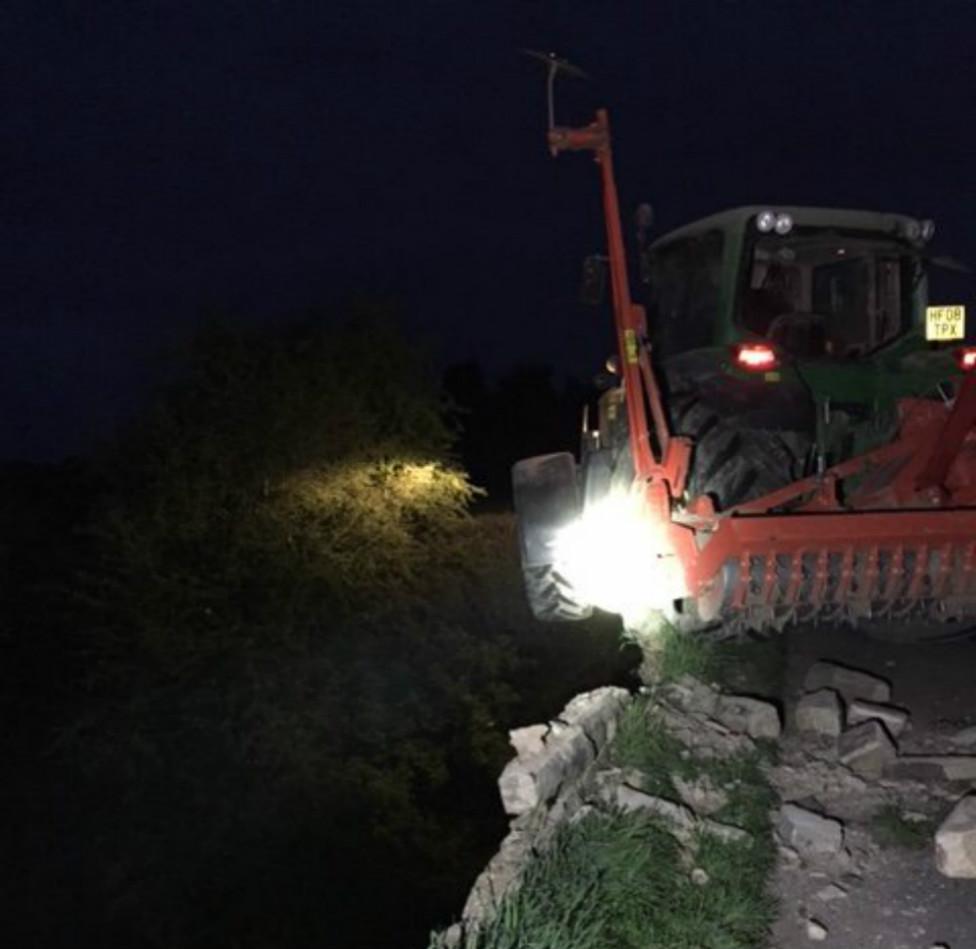 Tractor embedded in bridge
