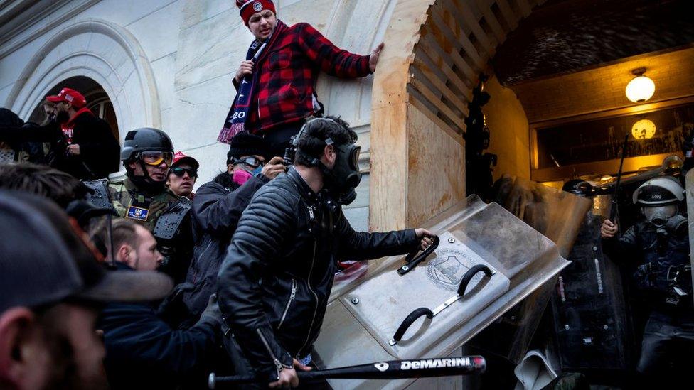 Trump supporters clash with police and security forces as people try to storm the US Capitol on January 6, 2021 in Washington, DC