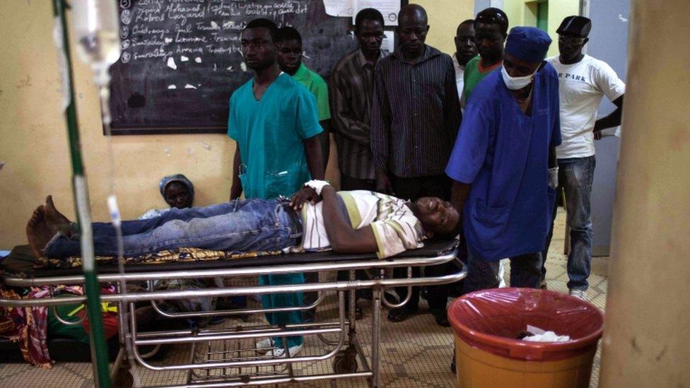 An injured protester on a stretcher in a hospital in Ouagadougou, Burkina Faso, 17 September 2015