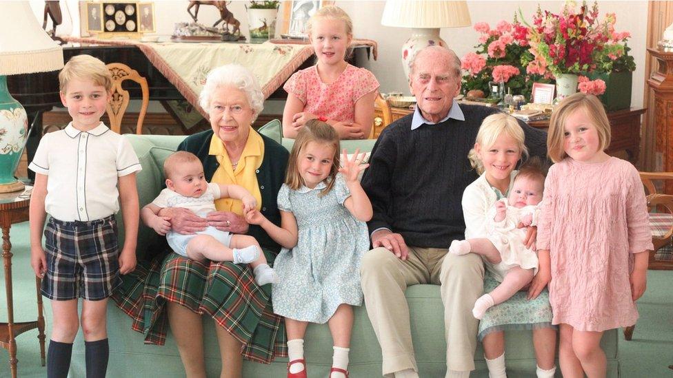 Undated handout image released on 14/04/21 of Queen Elizabeth II and the Duke of Edinburgh with their great grandchildren. Pictured (left to right) Prince George, Prince Louis being held by Queen Elizabeth II, Savannah Phillips (standing at rear), Princess Charlotte, the Duke of Edinburgh, Isla Phillips holding Lena Tindall, and Mia Tindall.