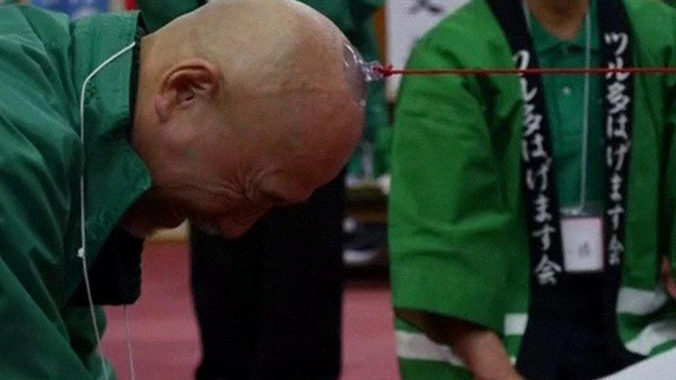 Japanese men compete in a tug-of-war contest