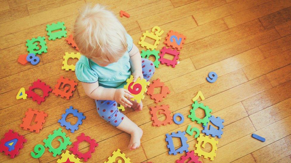 Child plays with toys