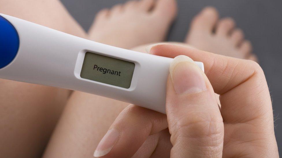 pregnancy test showing woman is pregnant