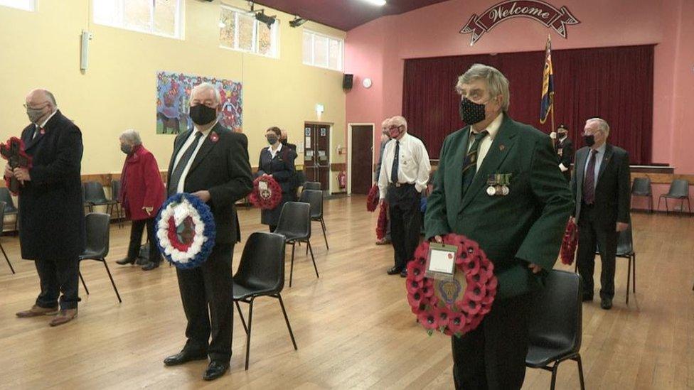 A group gather to commemorate Remembrance Day in Crossgar