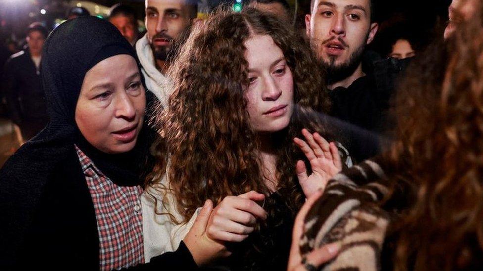 Palestinian activist Ahed Tamimi is pictured with her mother after being returned to the West Bank