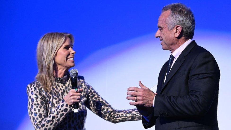 Robert F Kennedy standing next to Cheryl Hines