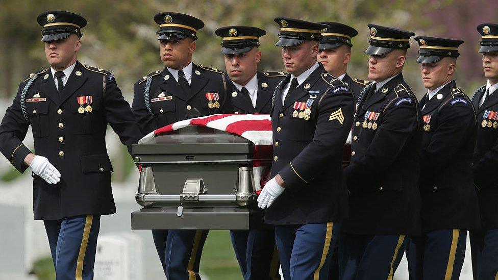 US soldiers move the casket of Korean War soldier US Army Sgt Wilson Meckley, Jr, during his graveside ceremony at Arlington National Cemetery in Washington. Photo: April 2016