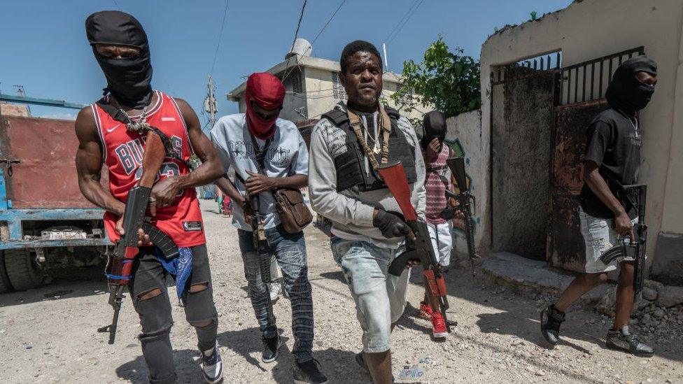 Gang Leader Jimmy 'Barbecue' Cherizier patrolling the streets with G-9 federation gang members in the Delmas 3 area on February 22, 2024, in Port-au-Prince, Haiti. There has a been fresh wave of violence in Port-au-Prince where, according to UN estimates, gangs control 80% of the city.