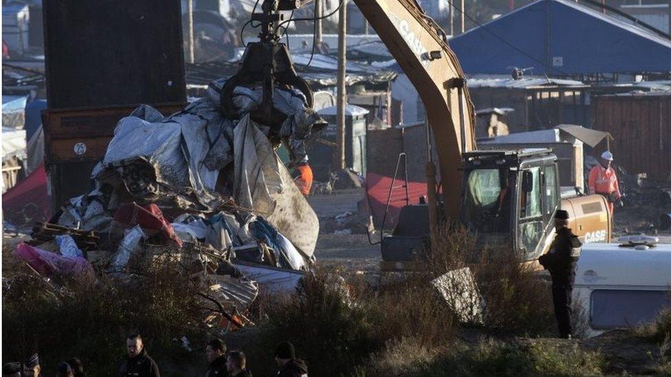 Workers continue dismantling of the makeshift camp "The Jungle" in Calais, France, 27 October 2016.