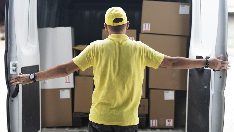 Stock image of man by a van