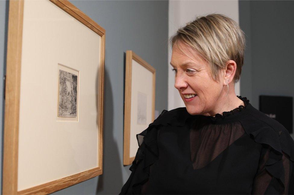 National Museums NI chief executive Kathryn Thomson viewing The Adoration of the Shepherds by Rembrandt