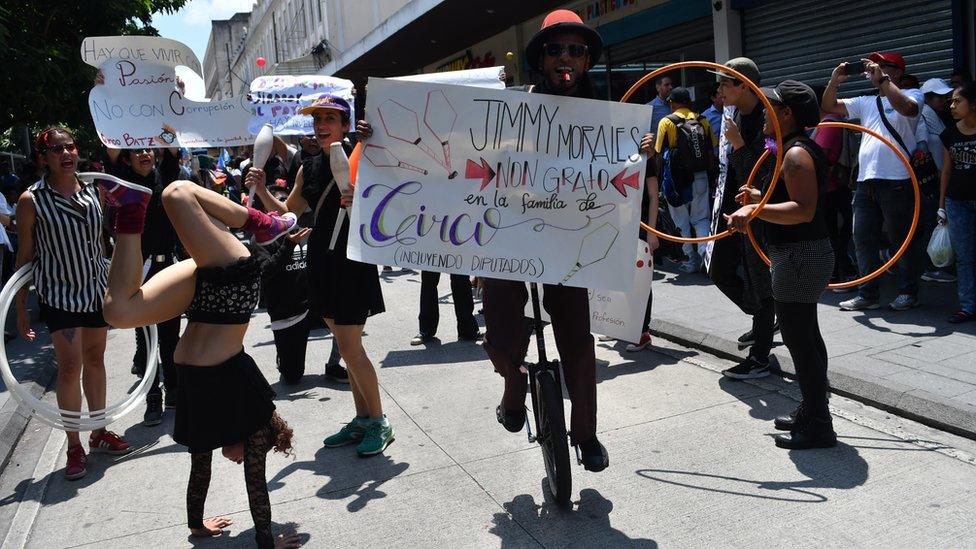 People from different social sectors march during a national strike demanding Guatemalan President Jimmy Morales and several lawmakers who are under a cloud of corruption suspicions to step down, in Guatemala City on September 20, 2017