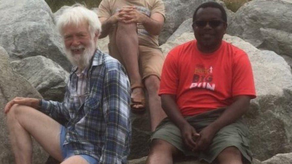 Robert Spooner (left) on a trip to Robin Hood's Bay, with Victor who was an asylum seeker from Zimbabwe