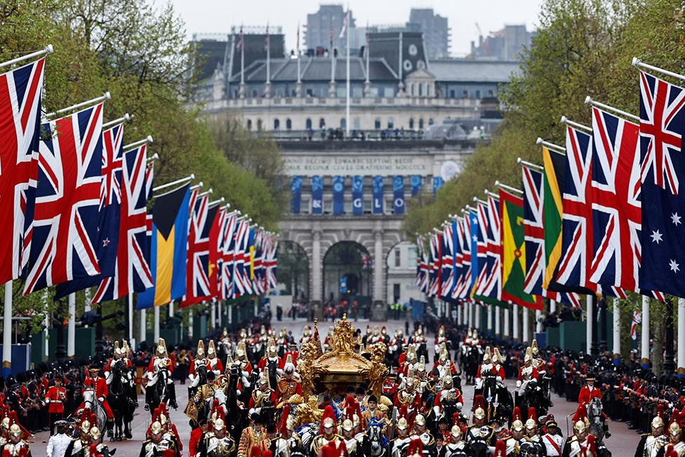 King Charles and Queen Camilla travel in the Gold State Coach, following their coronation