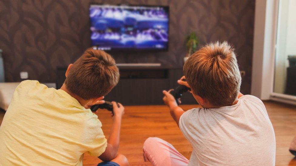 Two boys playing computer games