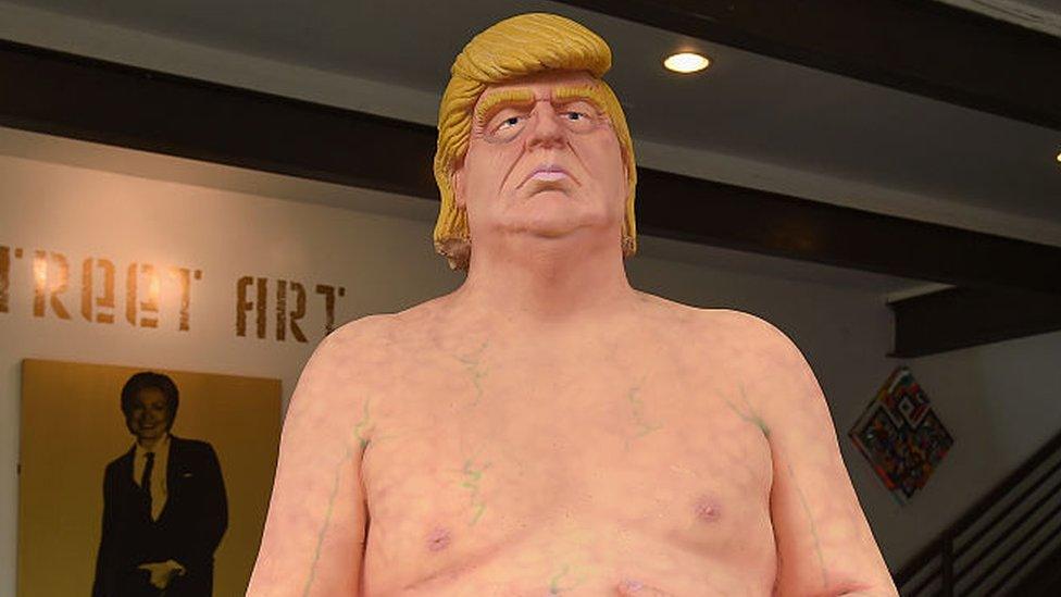 A naked statue of Donald Trump