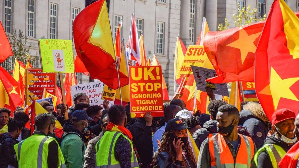 2021/04/25: Protesters gather while holding Tigray flags during the demonstration. Thousands of people marched through Central London in protest of what the demonstrators call Ethiopia's and Eritrea's "genocidal war" on the region of Tigray.