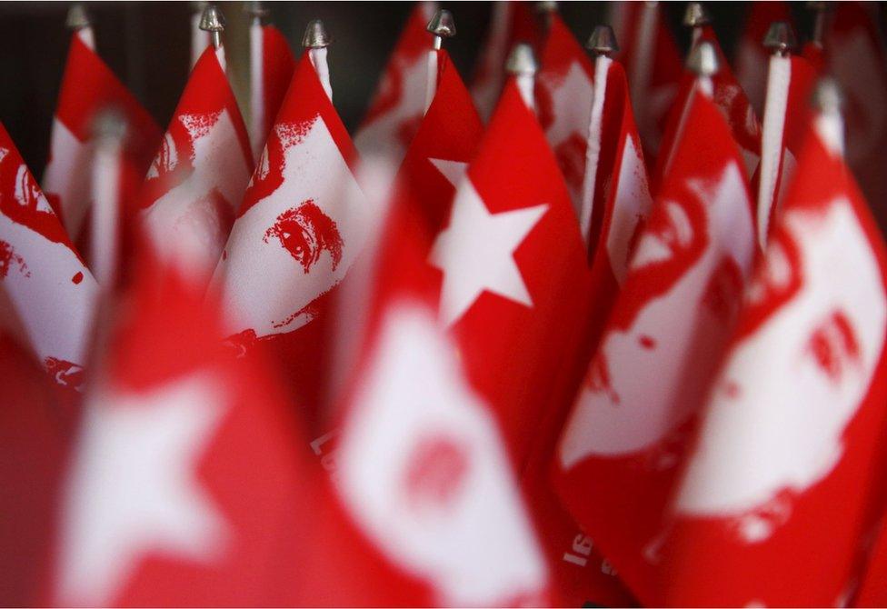 Flags with the image of Myanmar's opposition leader Aung San Suu Kyi are seen for sale ahead of Sunday's general election in Yangon, Myanmar, November 5, 2015