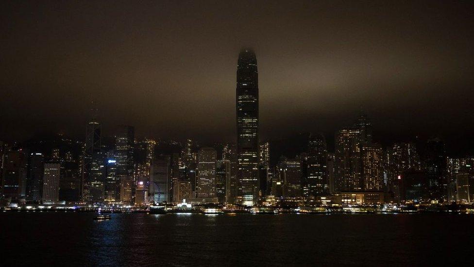 The Victoria Harbour is seen after its lights went out for the Earth Hour environmental campaign in Hong Kong on March 30, 2019.