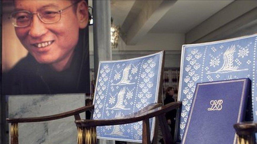 A picture of Liu Xiaobo next to his empty chair at the Nobel prize ceremony on 10 December 2010