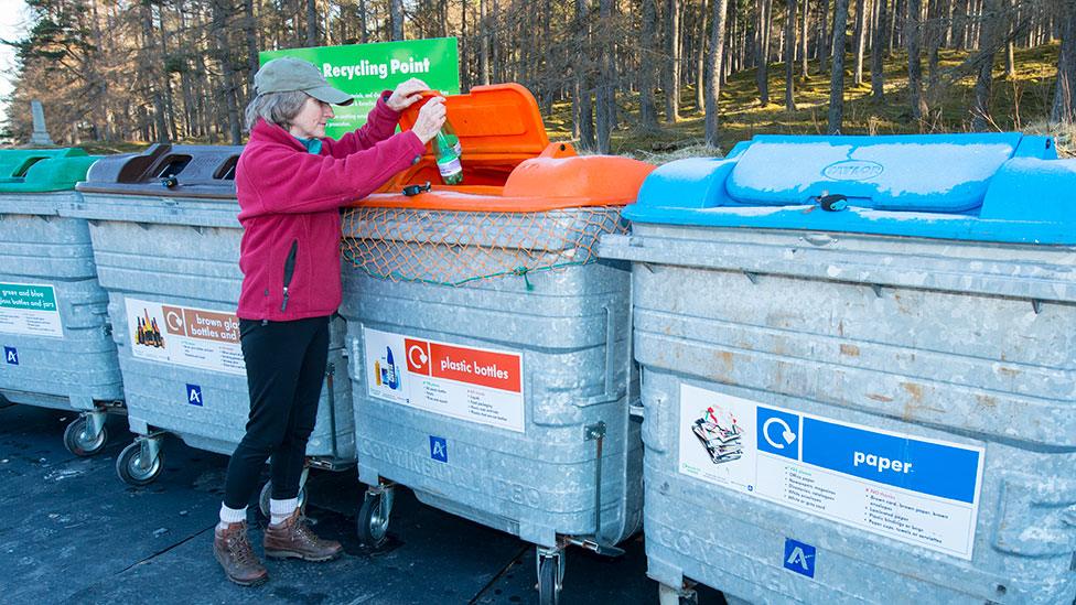 Woman at recycling bins in Braemar