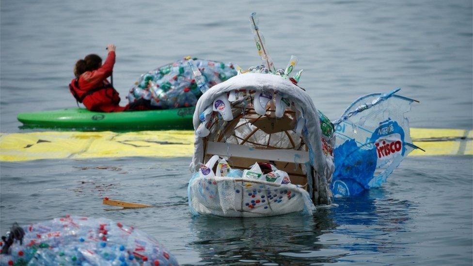 A model of a monster made b y Greenpeace from plastic waste