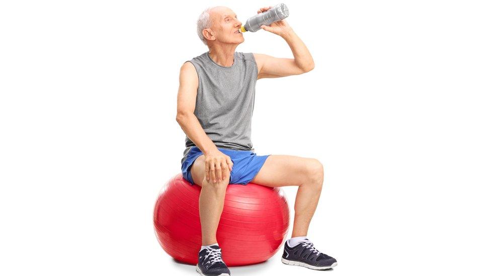 An older man exercising